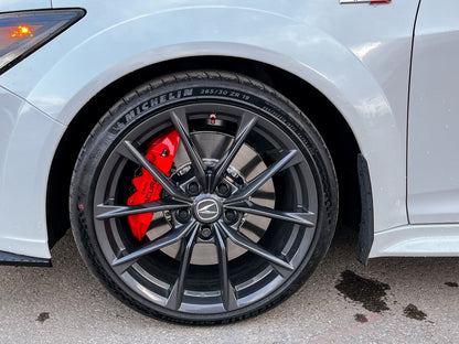 car wheel with a Michelin tire on a white vehicle.
